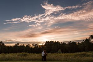 Dramatic sunset during a couples maternity session
